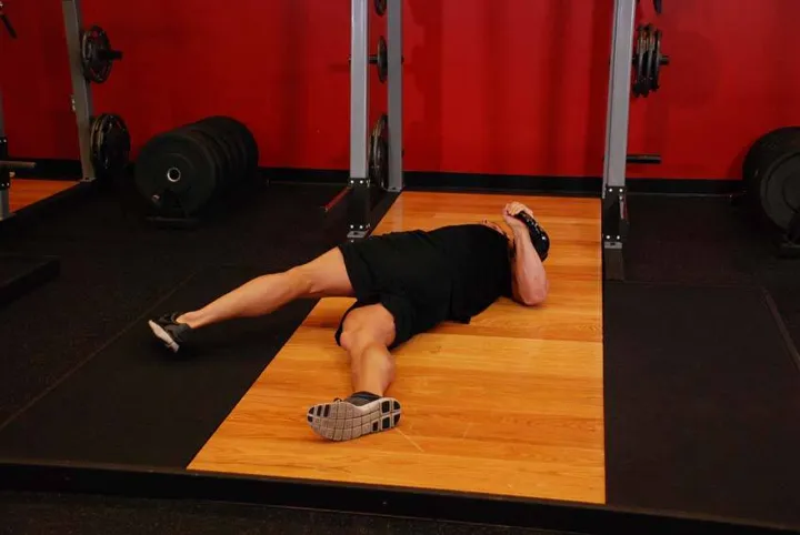 Leg-Over Floor Press — posição inicial