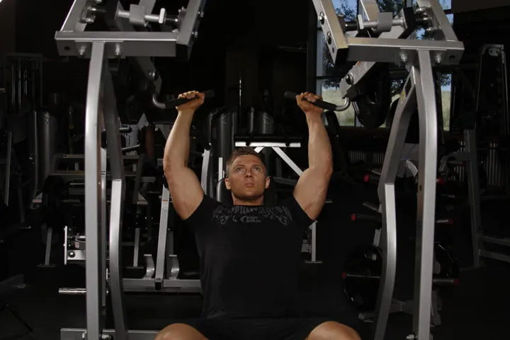 Leverage Shoulder Press — contração