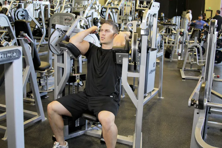 Machine Bicep Curl — contração