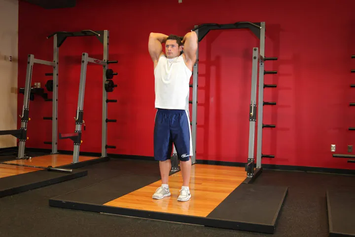 Standing Dumbbell Triceps Extension — contração