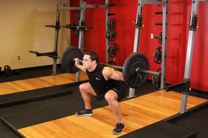 Wide Stance Barbell Squat — contração